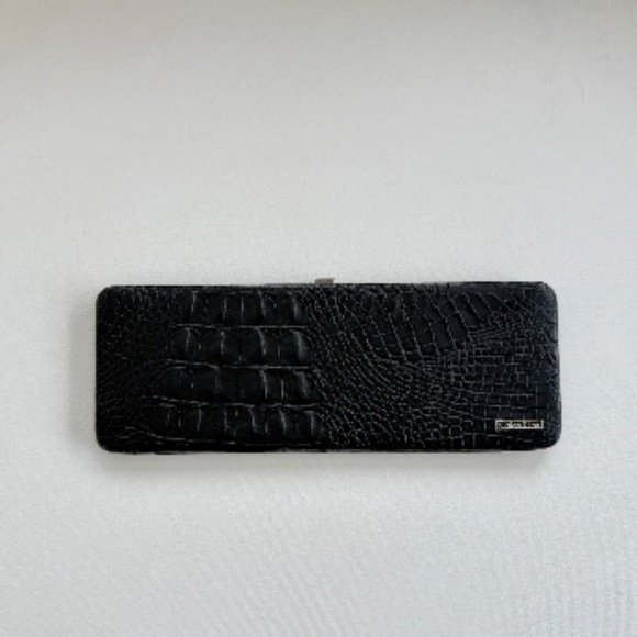 Calvin Klein Handbags - NWOT Calvin Klein Slim Leather Clutch - Black